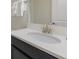 Bathroom with single vanity, updated fixtures and white countertop at 1560 Flange Dr, Davenport, FL 33896