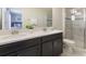 Double vanity bathroom with a large walk in shower at 1560 Flange Dr, Davenport, FL 33896