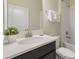 Clean bathroom with single vanity and shower/tub combo at 1560 Flange Dr, Davenport, FL 33896