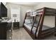 Bedroom with a bunk bed and dresser. Mickey Mouse theme at 1560 Flange Dr, Davenport, FL 33896
