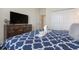 Bedroom with king-size bed, dresser and TV at 1560 Flange Dr, Davenport, FL 33896