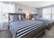 Bedroom with two twin-size beds with blue and white bedding at 1560 Flange Dr, Davenport, FL 33896