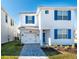 Two-story house with blue shutters and a white exterior at 1560 Flange Dr, Davenport, FL 33896