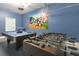 Game room with foosball, pool table, and Mickey Mouse mural at 1560 Flange Dr, Davenport, FL 33896