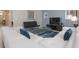 Living area with white sectional and dark accent chairs at 1560 Flange Dr, Davenport, FL 33896