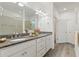 Elegant bathroom with double vanity and granite countertops at 217 Montoro Ln, Davenport, FL 33837