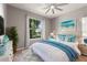 Charming bedroom with a queen-size bed and blue accents at 217 Montoro Ln, Davenport, FL 33837
