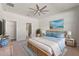 Main bedroom with ensuite bathroom access and ceiling fan at 217 Montoro Ln, Davenport, FL 33837