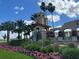 Community entrance with fountain and landscaping at 217 Montoro Ln, Davenport, FL 33837