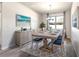 Bright dining room featuring a rustic wood table and a stylish rug at 217 Montoro Ln, Davenport, FL 33837