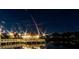 Night view of a lighted dock over calm water at 217 Montoro Ln, Davenport, FL 33837