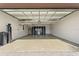 Spacious two-car garage with epoxy flooring and overhead storage at 217 Montoro Ln, Davenport, FL 33837
