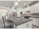 Modern kitchen with a large island and white cabinets at 217 Montoro Ln, Davenport, FL 33837