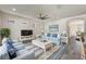 Light and airy living room featuring a comfy sofa and coffee table at 217 Montoro Ln, Davenport, FL 33837