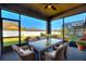 Relaxing screened patio with seating for dining al fresco at 217 Montoro Ln, Davenport, FL 33837