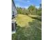 Large grassy backyard with ample space for outdoor activities at 2614 Old Kent Cir, Kissimmee, FL 34758