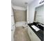 Clean bathroom with tub, toilet and granite vanity at 2614 Old Kent Cir, Kissimmee, FL 34758