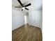 Spacious bedroom with double doors and wood-look floors at 2614 Old Kent Cir, Kissimmee, FL 34758