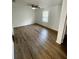 Bright bedroom featuring wood-look floors and a ceiling fan at 2614 Old Kent Cir, Kissimmee, FL 34758