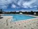 Relaxing community pool with fountain and ample lounge chairs at 2614 Old Kent Cir, Kissimmee, FL 34758