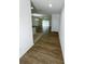 Bright and spacious entryway with wood-look flooring and views to living room and kitchen at 2614 Old Kent Cir, Kissimmee, FL 34758