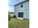 Rear view of a single Gathering home with sliding glass doors at 2614 Old Kent Cir, Kissimmee, FL 34758