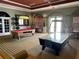 Community game room with pool table and air hockey at 2614 Old Kent Cir, Kissimmee, FL 34758