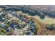 High-angle aerial shot of a charming home nestled in a serene residential area near a lush green space at 26622 Bull Run, Leesburg, FL 34748