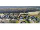 Aerial view of a well-maintained home in a suburban neighborhood with lush green surroundings and mature trees at 26622 Bull Run, Leesburg, FL 34748