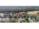 Stunning aerial view of a residential neighborhood nestled among lush greenery and mature trees at 26622 Bull Run, Leesburg, FL 34748
