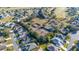 Picturesque aerial view of a residential area showcasing tennis courts, golf course and beautifully lined trees at 26622 Bull Run, Leesburg, FL 34748