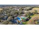 Aerial view of community amenities including swimming pools, clubhouse, and golf course, showcasing a recreational lifestyle at 26622 Bull Run, Leesburg, FL 34748