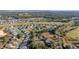 Beautiful aerial view of a residential community with lush green golf courses, trees, and manicured lawns at 26622 Bull Run, Leesburg, FL 34748