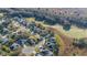High-angle aerial shot of a charming home nestled in a serene residential area near a lush green space at 26622 Bull Run, Leesburg, FL 34748