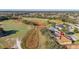 Aerial view of golf community home with screened lanai backing up to the golf course at 26622 Bull Run, Leesburg, FL 34748