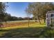 Beautiful view of the golf course from the backyard, with mature trees providing shade and privacy at 26622 Bull Run, Leesburg, FL 34748