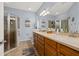 Spacious bathroom with a double vanity, shower with glass doors, and ample storage at 26622 Bull Run, Leesburg, FL 34748