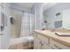 Well-lit bathroom with a shower-tub combo and a modern vanity, perfect for comfortable living at 26622 Bull Run, Leesburg, FL 34748
