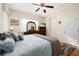 Bright bedroom features a ceiling fan and view of a television at 26622 Bull Run, Leesburg, FL 34748