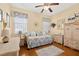 Cozy bedroom with charming decor, hardwood floors, and ample natural light at 26622 Bull Run, Leesburg, FL 34748