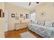 Comfortable bedroom with hardwood floors, day bed, and natural light at 26622 Bull Run, Leesburg, FL 34748