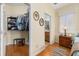 Walk in closet with shelving, access to ensuite bathroom, and hardwood floors at 26622 Bull Run, Leesburg, FL 34748