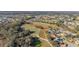 Scenic aerial view of a golf course community with homes surrounded by trees and fairways at 26622 Bull Run, Leesburg, FL 34748