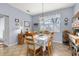 Bright dining room with stylish lighting, neutral colors, and a view of the outdoors at 26622 Bull Run, Leesburg, FL 34748