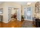 Elegant foyer with hardwood floors, decorative glass door, and a view of the study at 26622 Bull Run, Leesburg, FL 34748