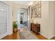 Bright foyer with hardwood floors, decorative wall tiles, and a view of the front porch at 26622 Bull Run, Leesburg, FL 34748