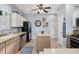Well-lit kitchen with stainless steel appliances, an island, and light-colored cabinets at 26622 Bull Run, Leesburg, FL 34748