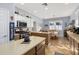Well-lit kitchen and breakfast nook with stainless steel appliances and center island at 26622 Bull Run, Leesburg, FL 34748