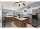 Spacious kitchen with ample counter space, stainless steel appliances, and a center island at 26622 Bull Run, Leesburg, FL 34748