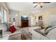 Comfortable living room with a fireplace, plush seating, and hardwood floors at 26622 Bull Run, Leesburg, FL 34748